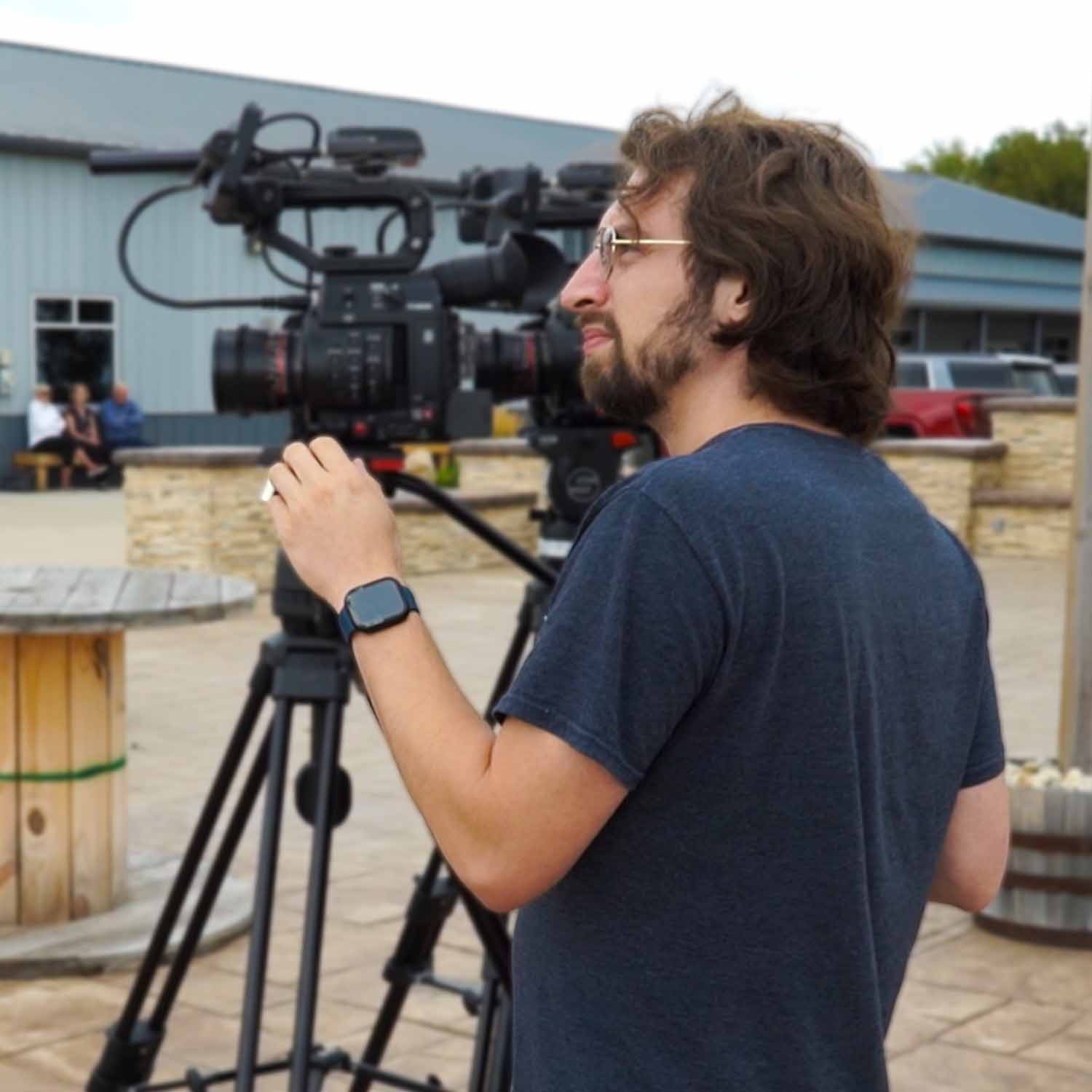 Kyle Coronado on set with a Canon cinema camera